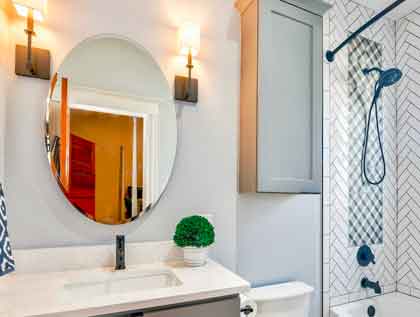 Try and install mirror-integrated storage in your diminutive bathroom